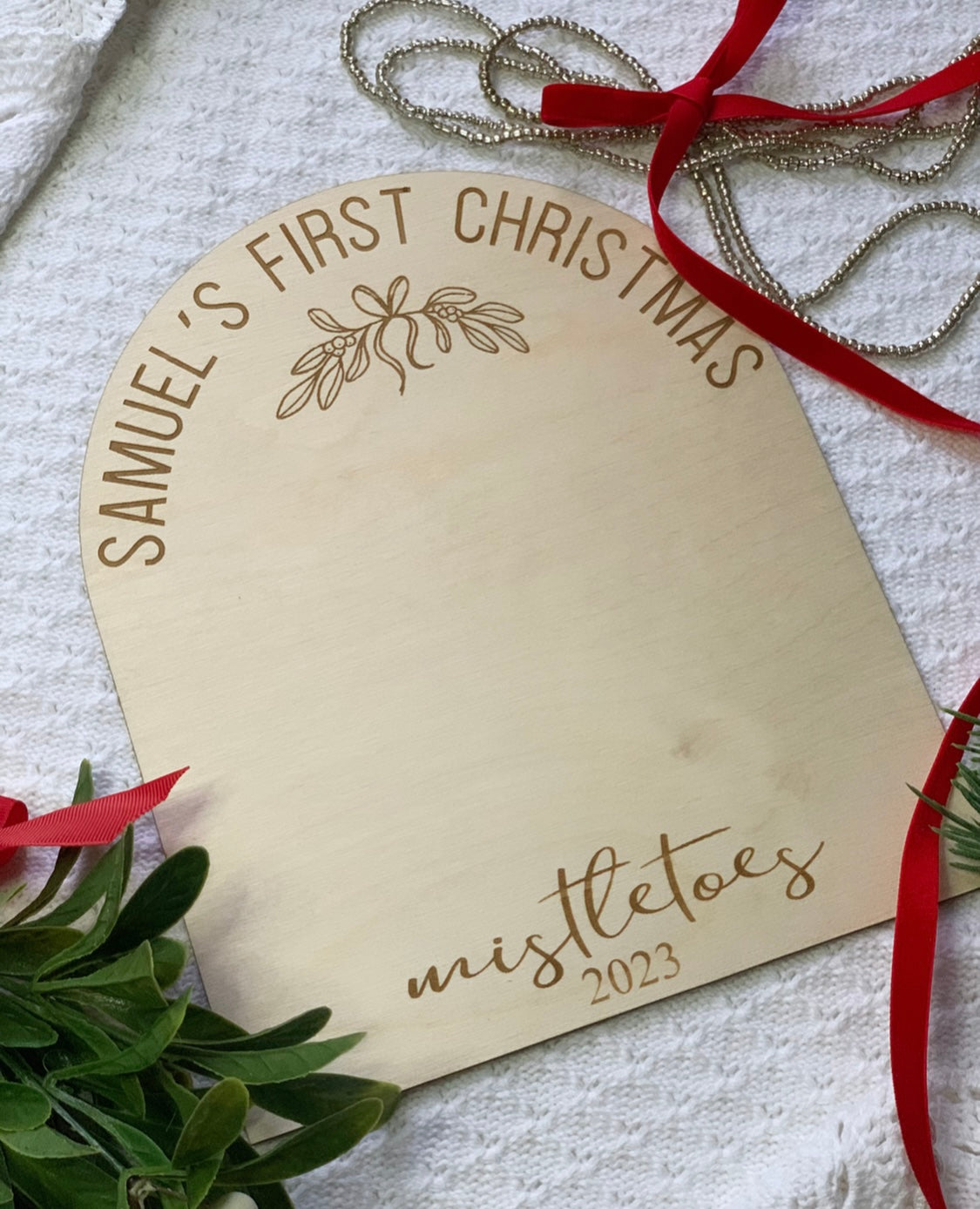 First Christmas mistletoes footprint board